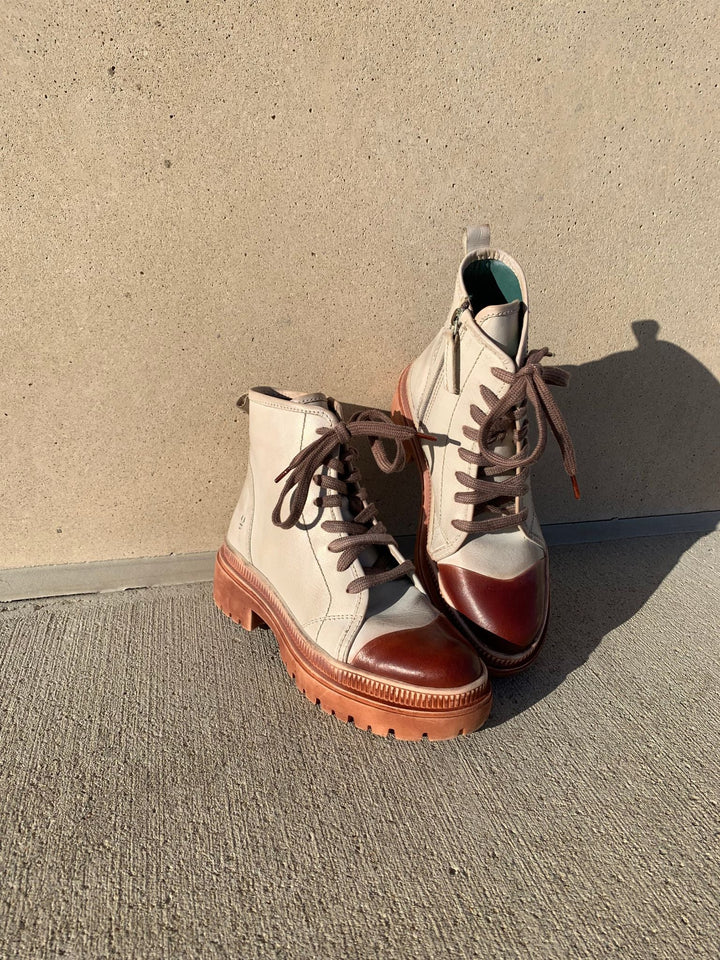 cream and brown lace up hiker boots