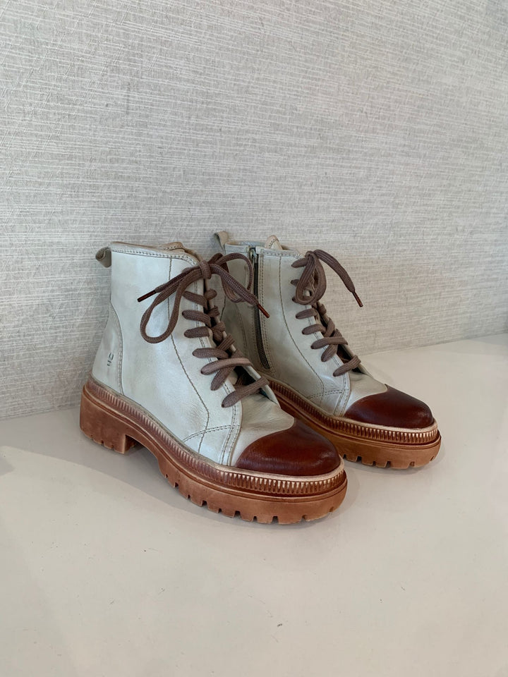 cream and brown lace up hiker boots