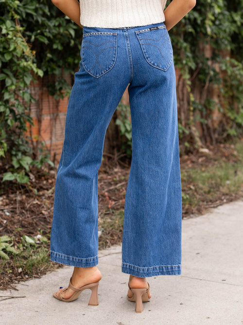 studded medium wash flared denim