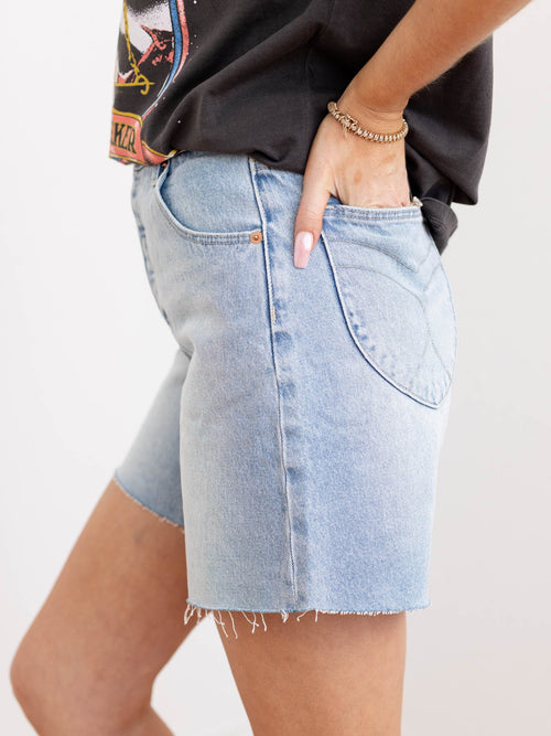 light wash long inseam cut off denim shorts