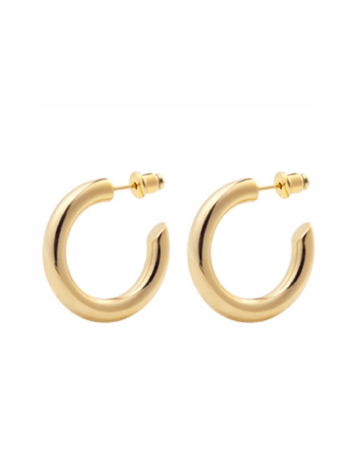 Gold hoop earrings on a white background