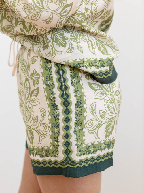 green and peach floral shorts