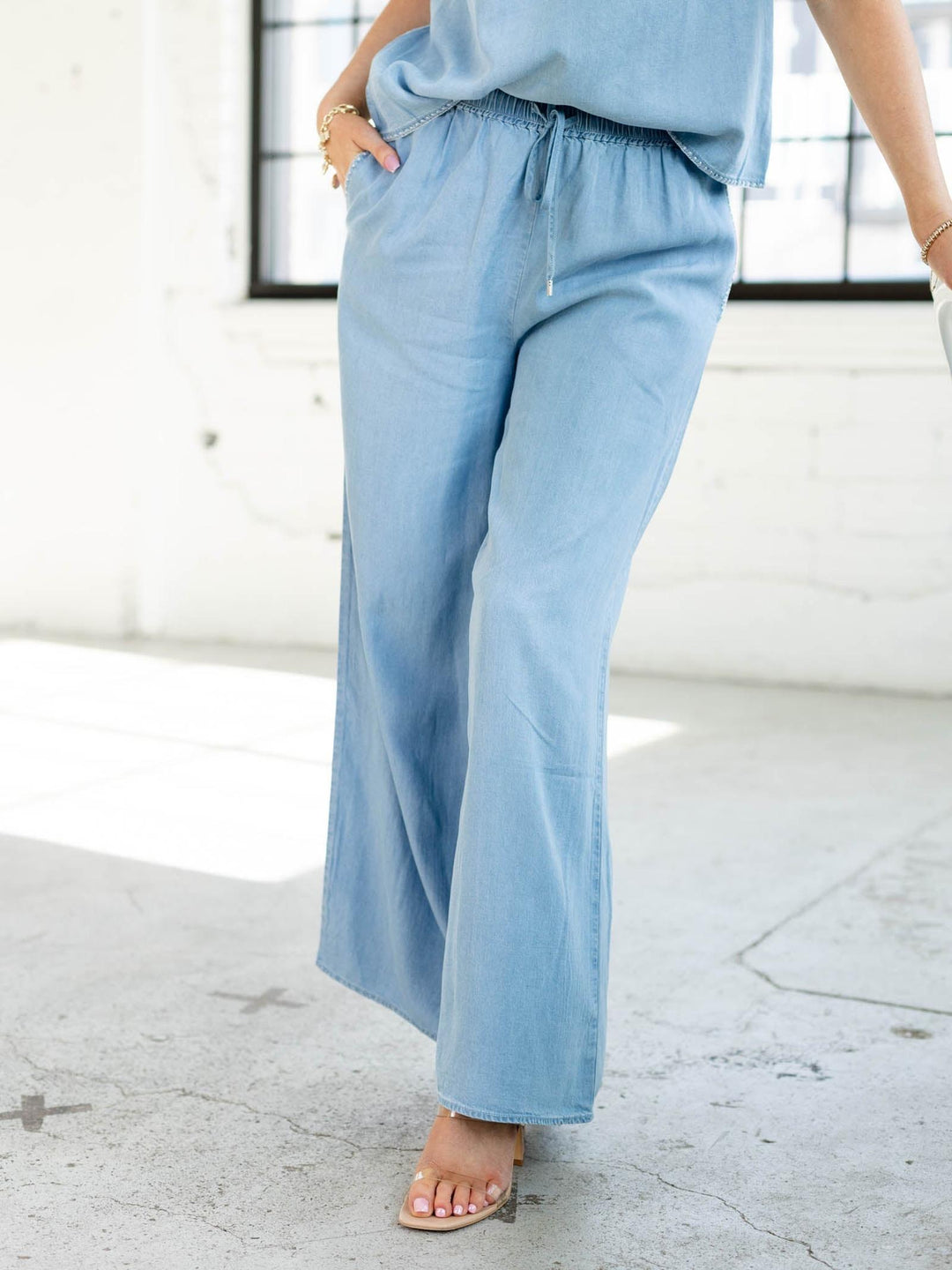 Light blue pants worn by a person in an indoor setting