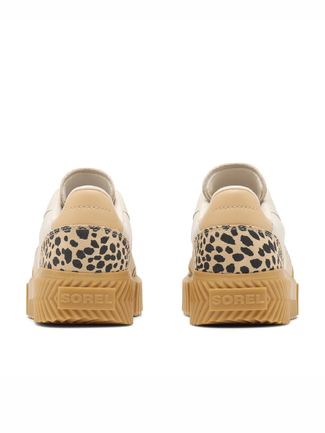 Pair of beige sneakers with leopard print accents on a white background