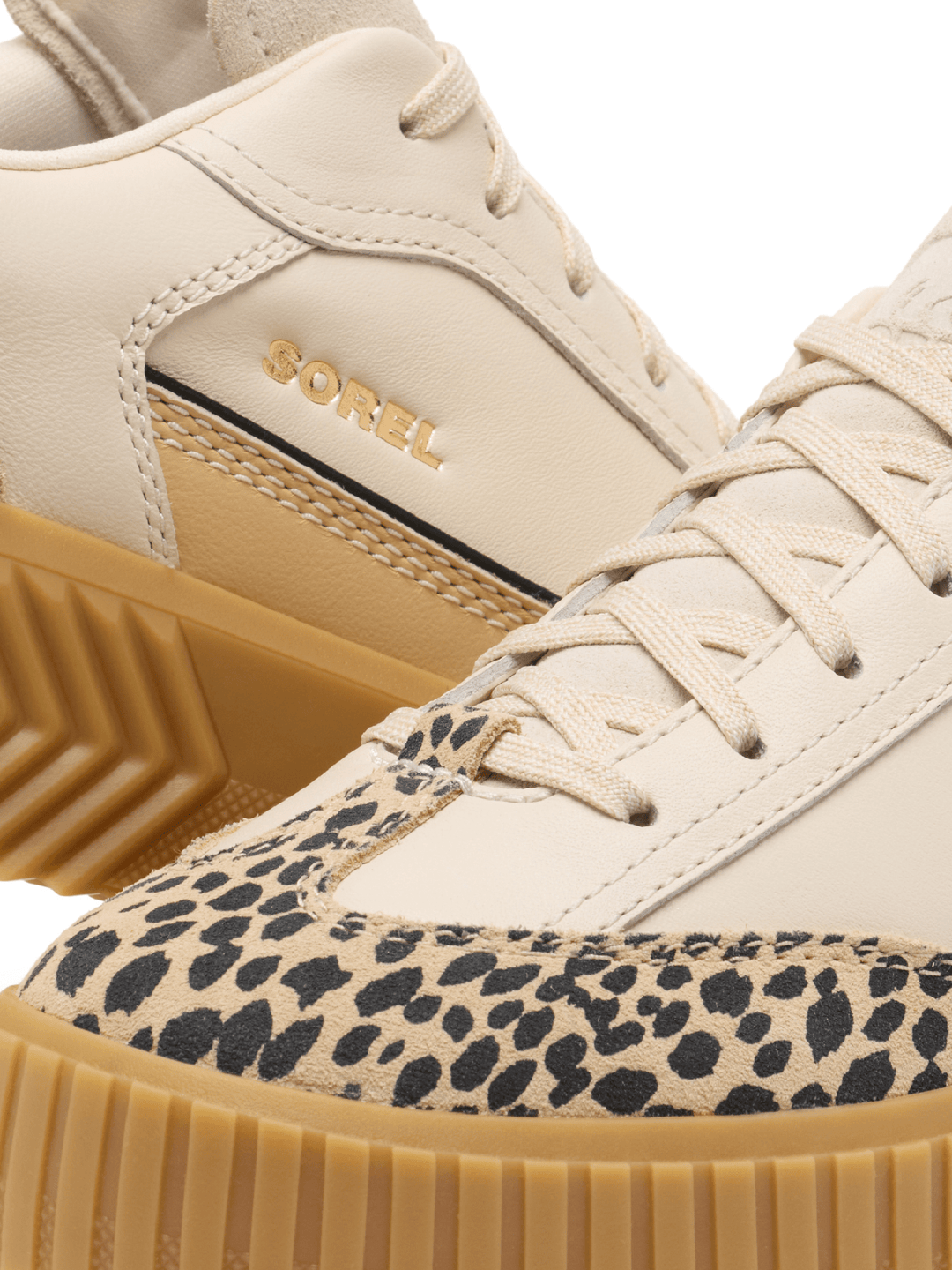 Beige sneaker with leopard print sole and Corel branding.