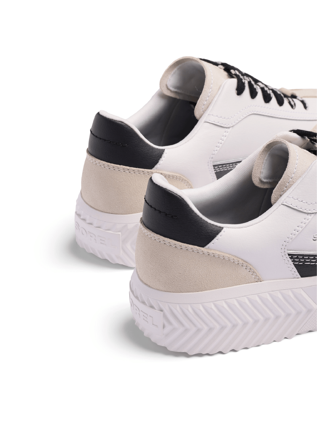 White sneakers with black accents on a white background