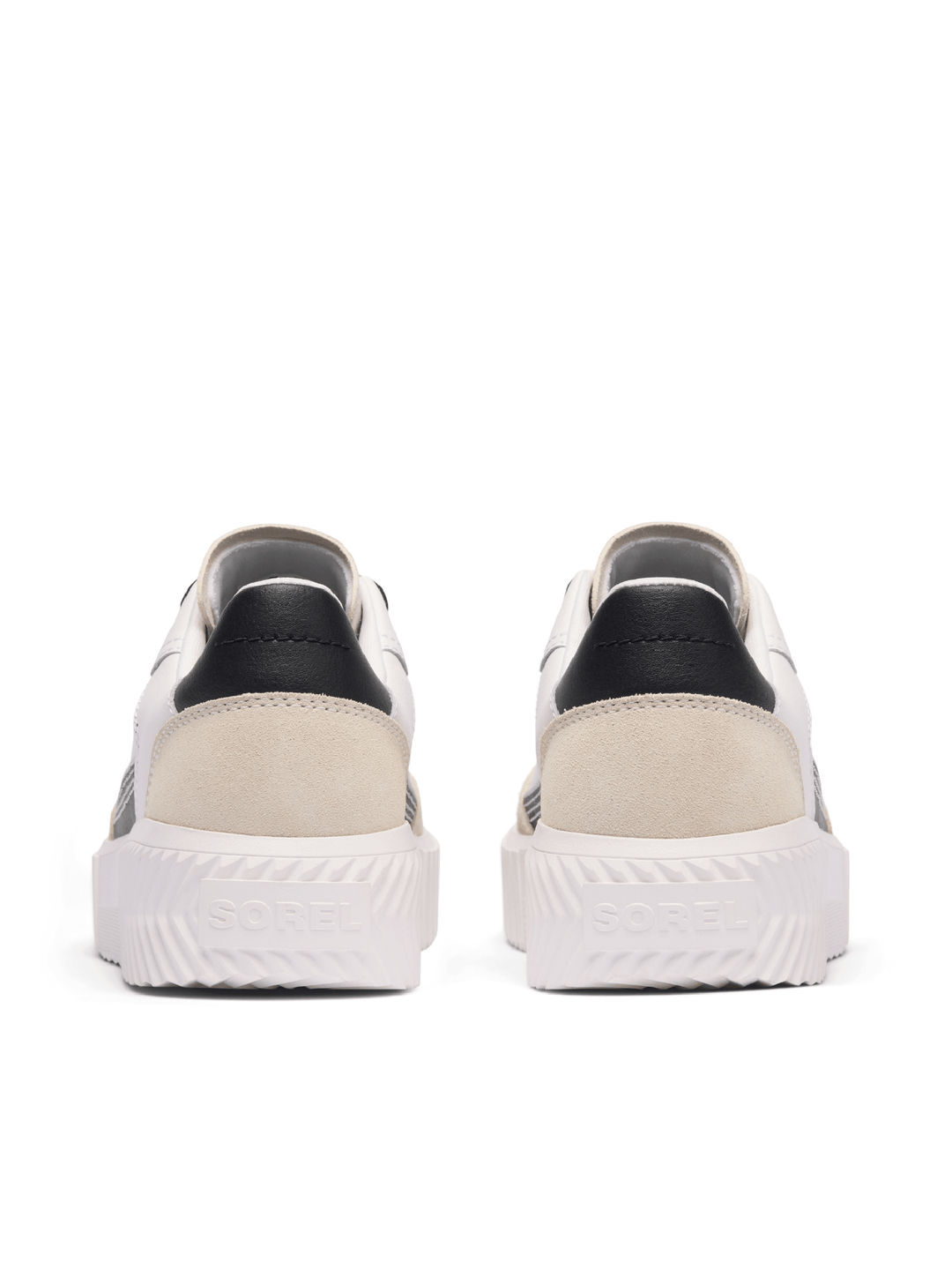 Pair of white sneakers with black accents on a white background