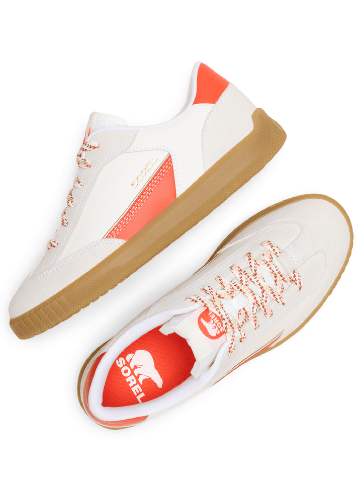 White sneakers with red accents and brown soles on a white background