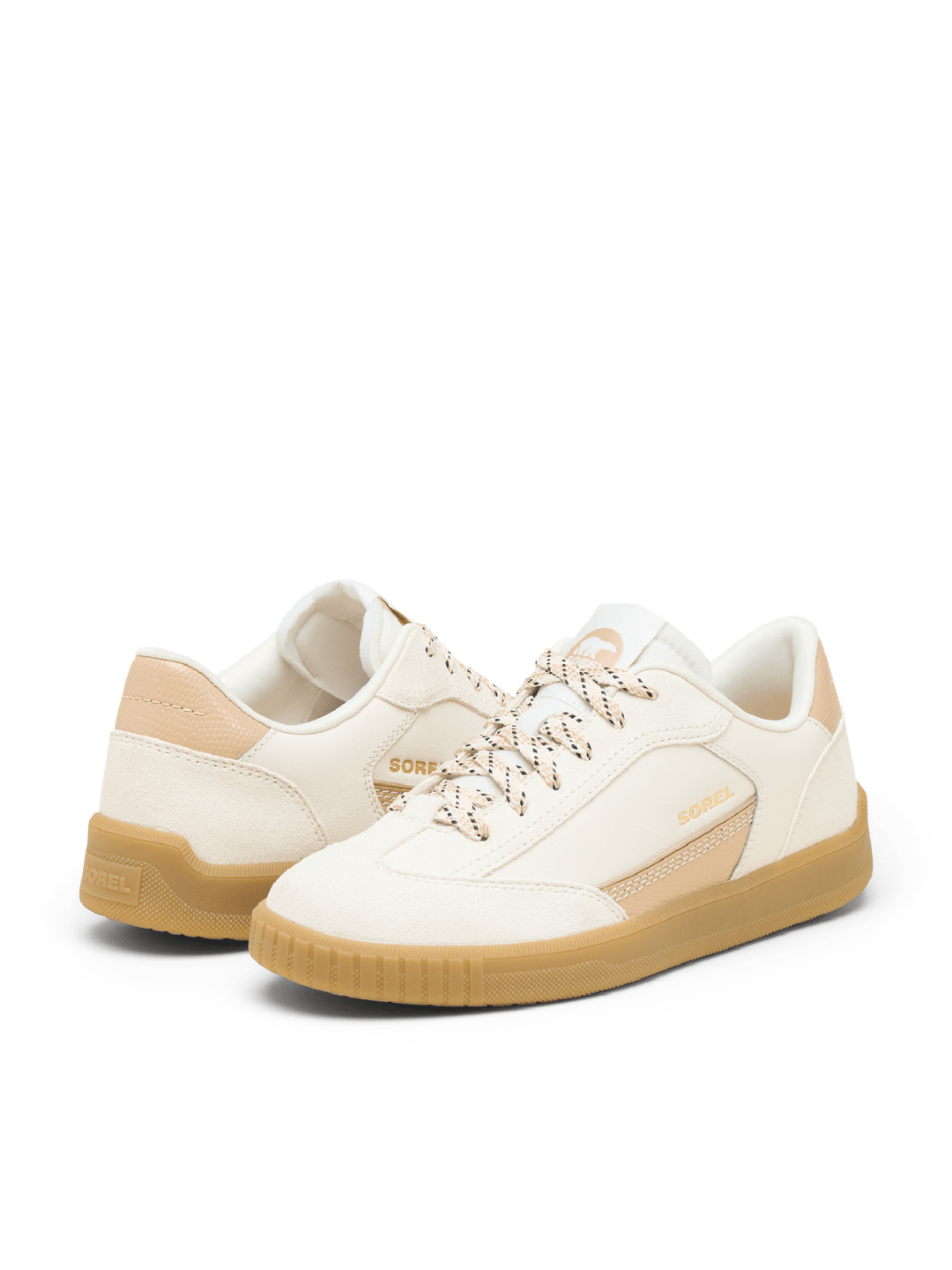 Pair of white sneakers with beige accents on a white background