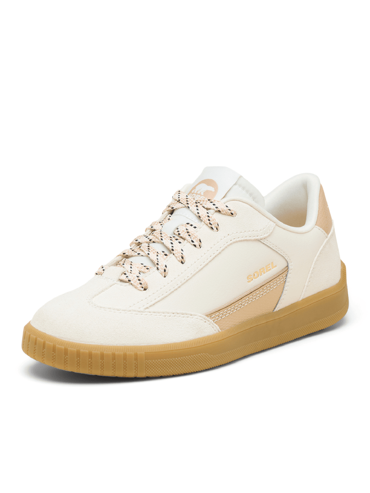 White sneaker with brown sole on a white background