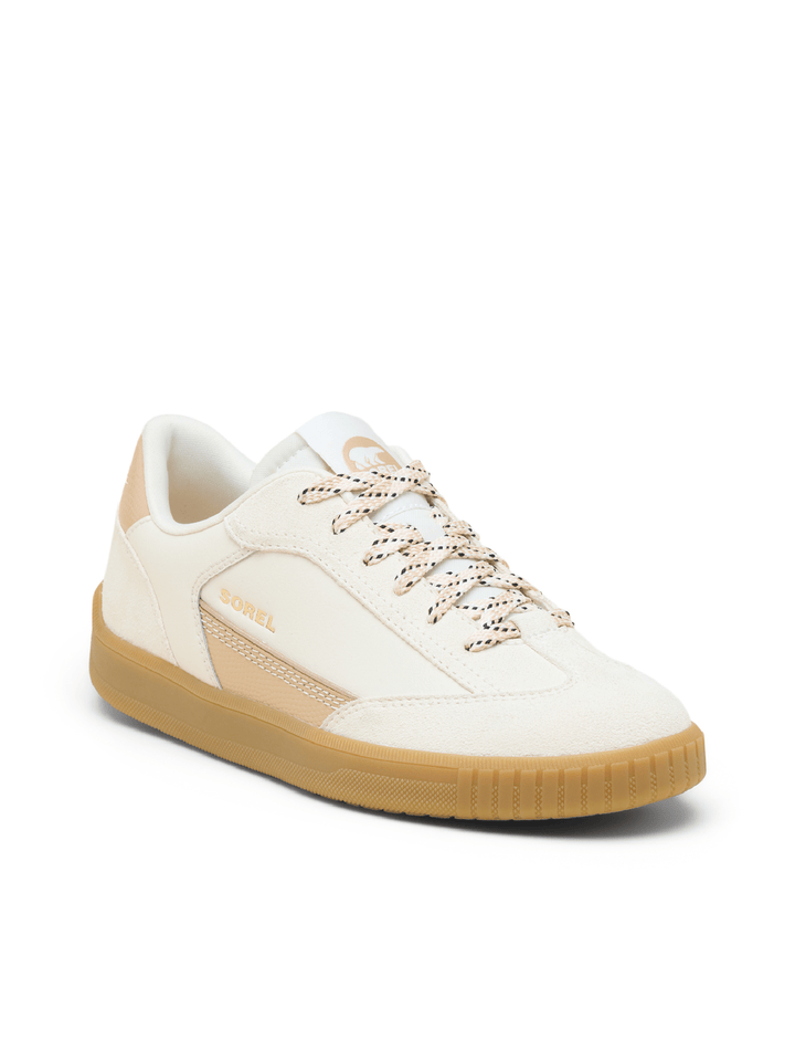 White sneaker with brown sole on a white background