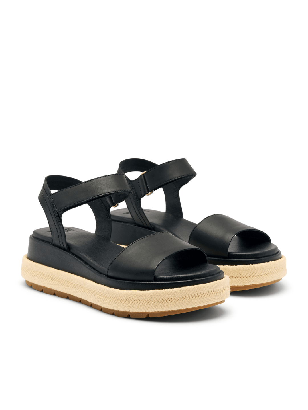 Black sandals with a beige sole on a white background