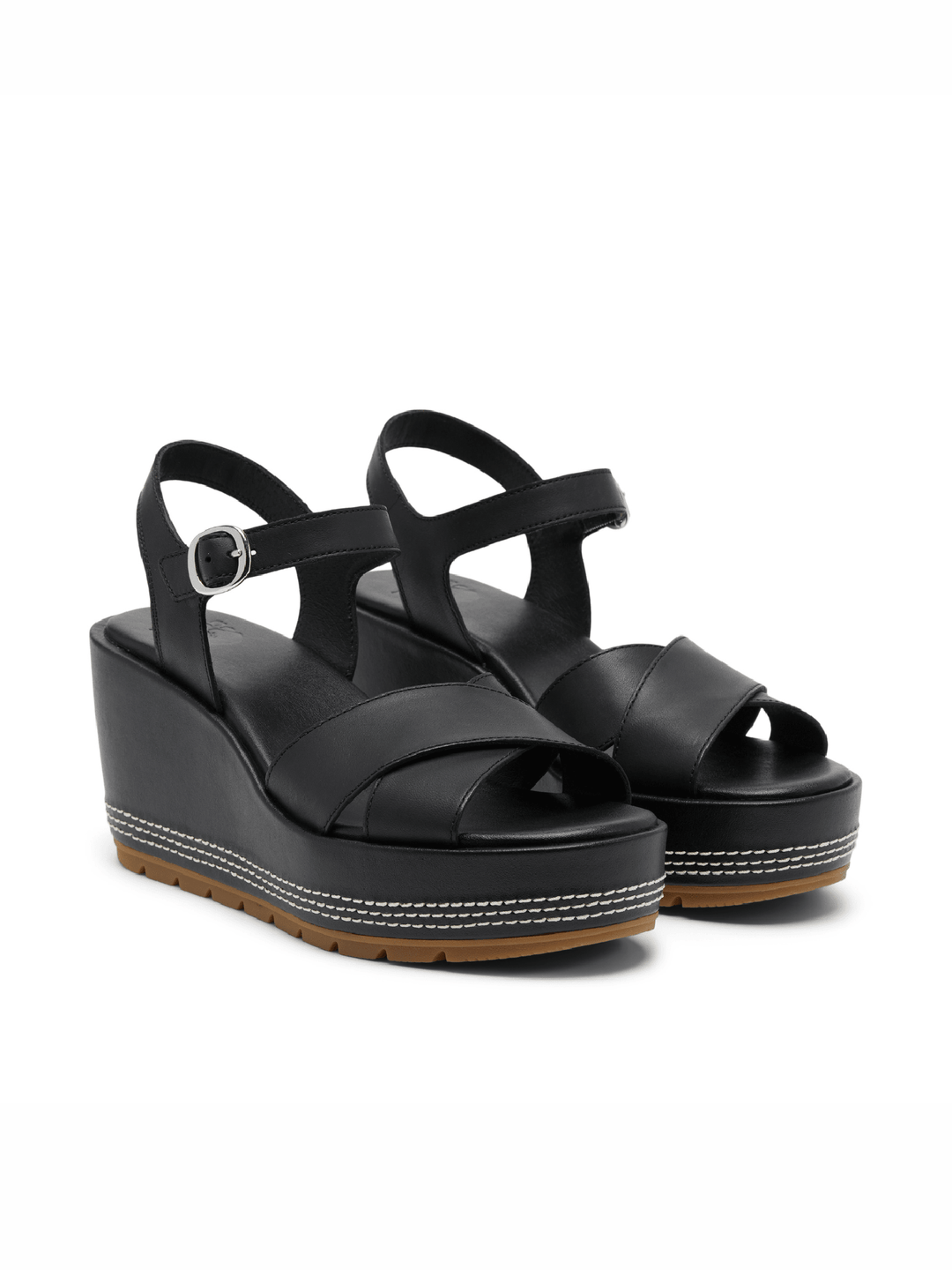 Black wedge sandals on a white background