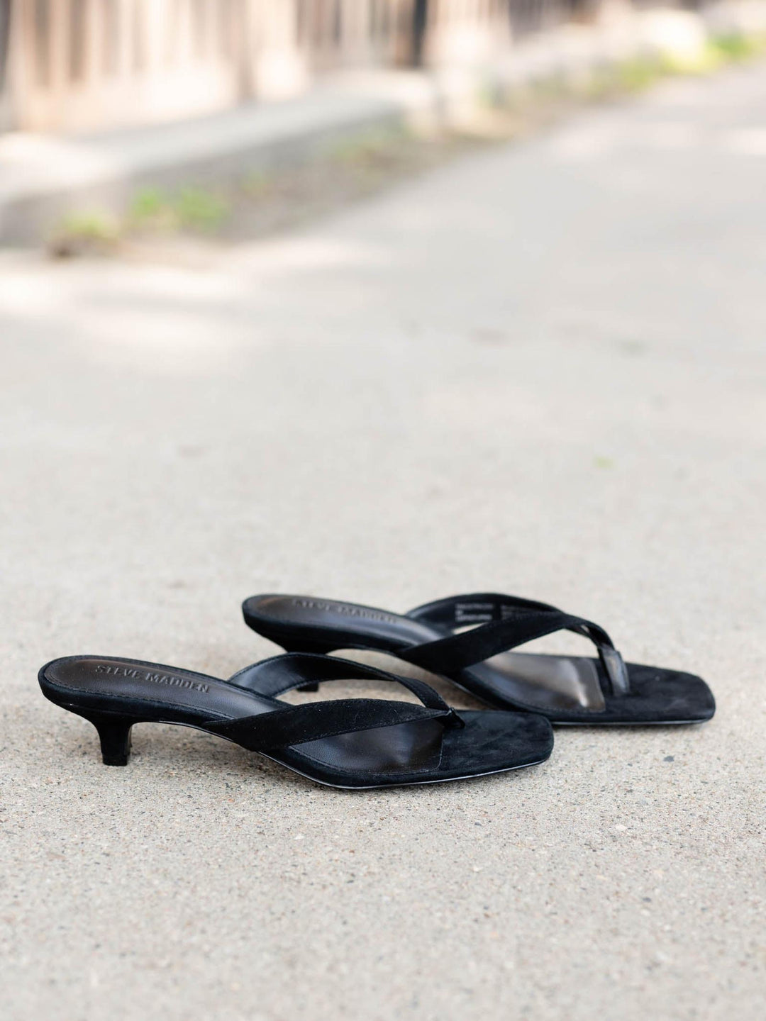 Steve Madden Tracy Sandal in black suede with kitten heels, square toe, and thong strap.