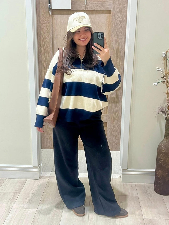 navy blue and cream striped half zip with navy blue trousers
