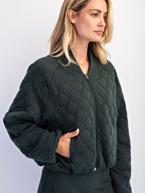 green quilted jacket