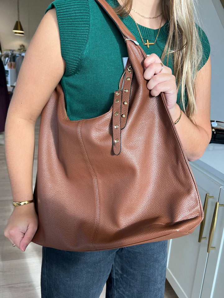 brown slouchy studded bag