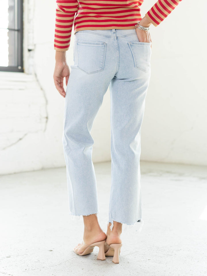 light wash distressed hem denim