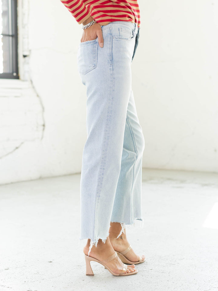 light wash distressed hem denim