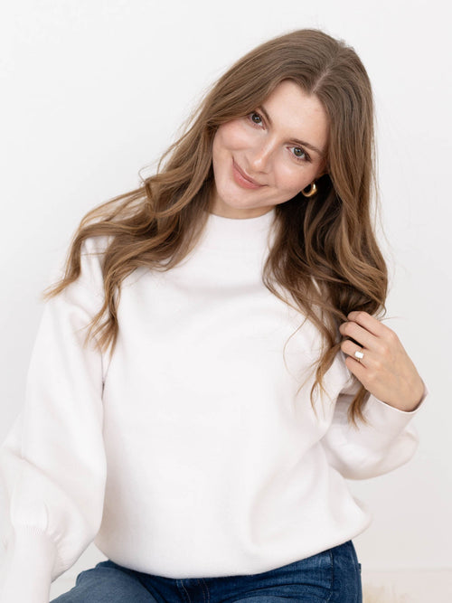 white mock neck sweater