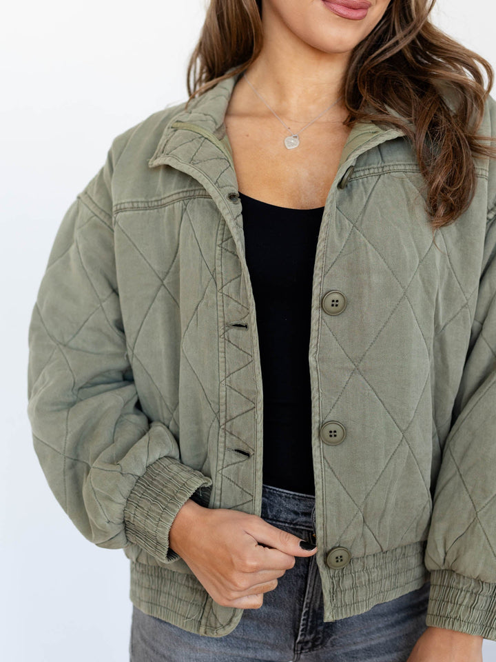 washed green quilted bomber jacket