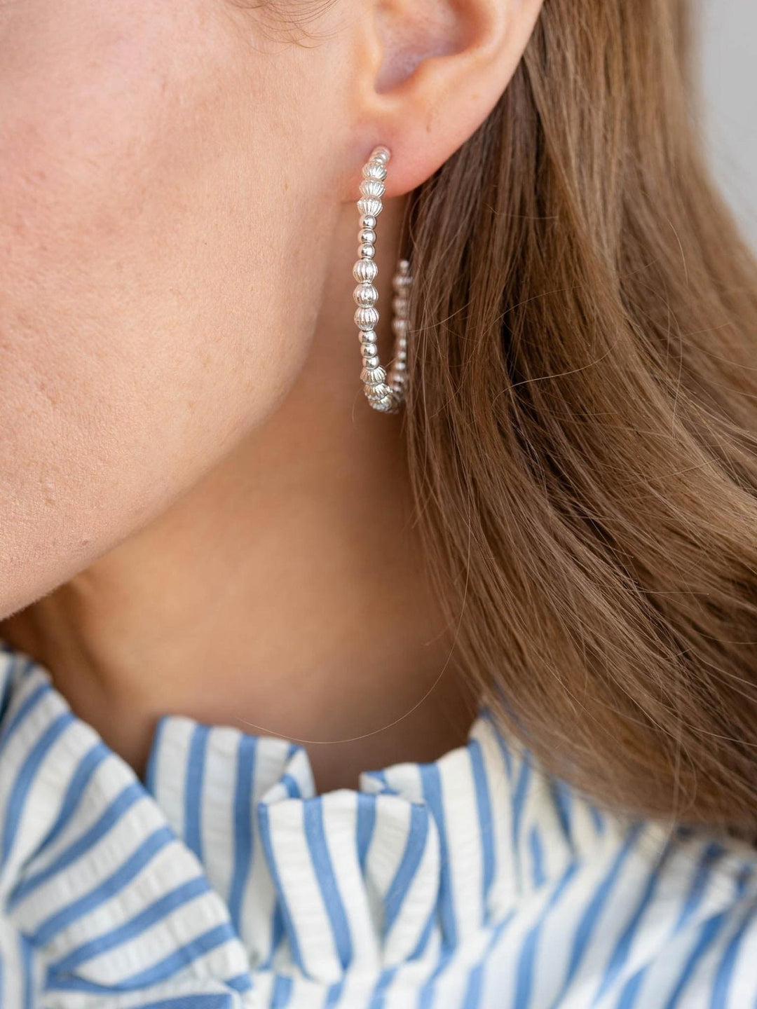 silver beaded hoop earring