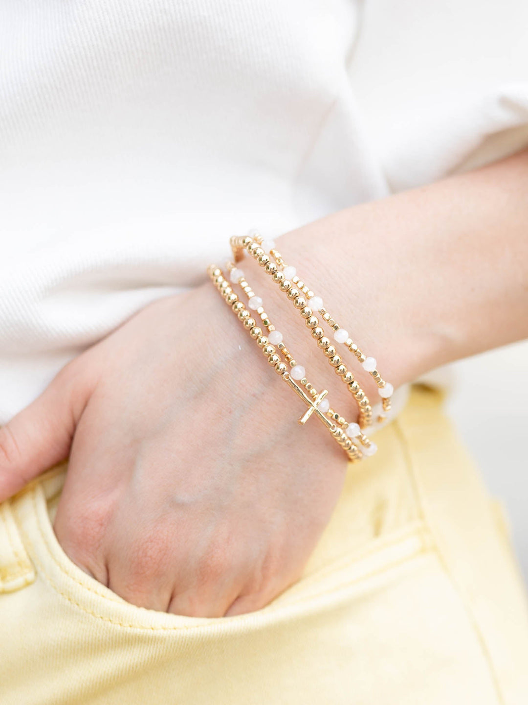 White and gold beaded bracelets