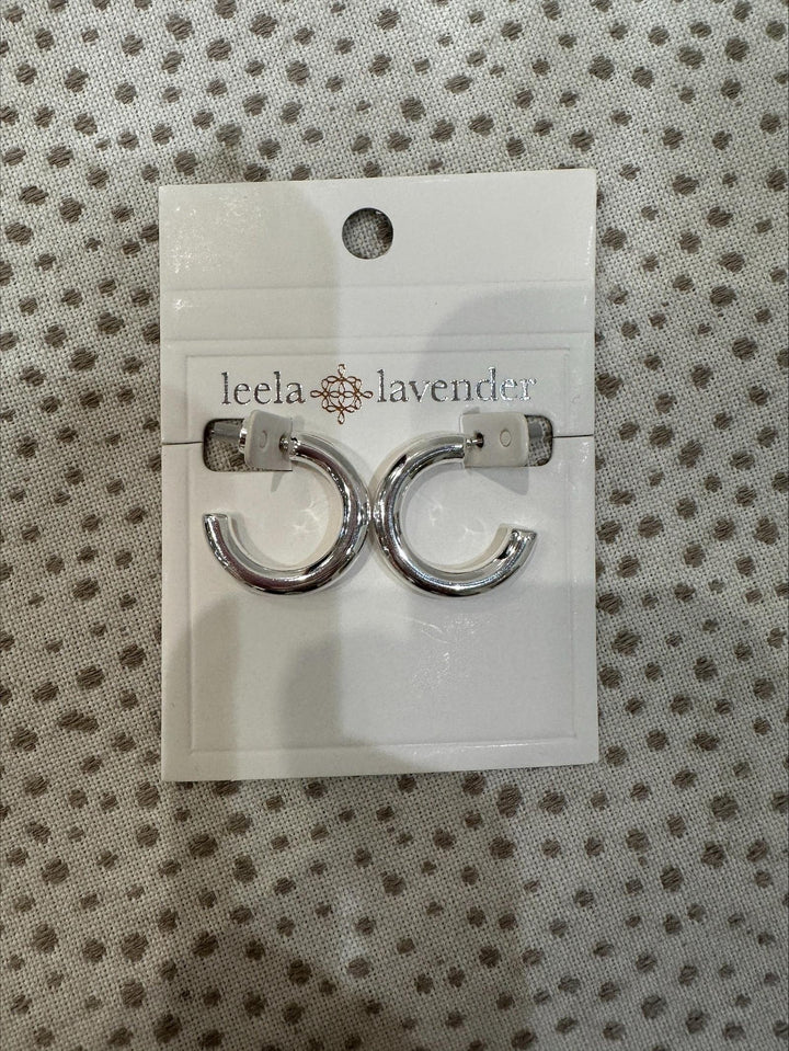 Pair of silver hoop earrings on a &
