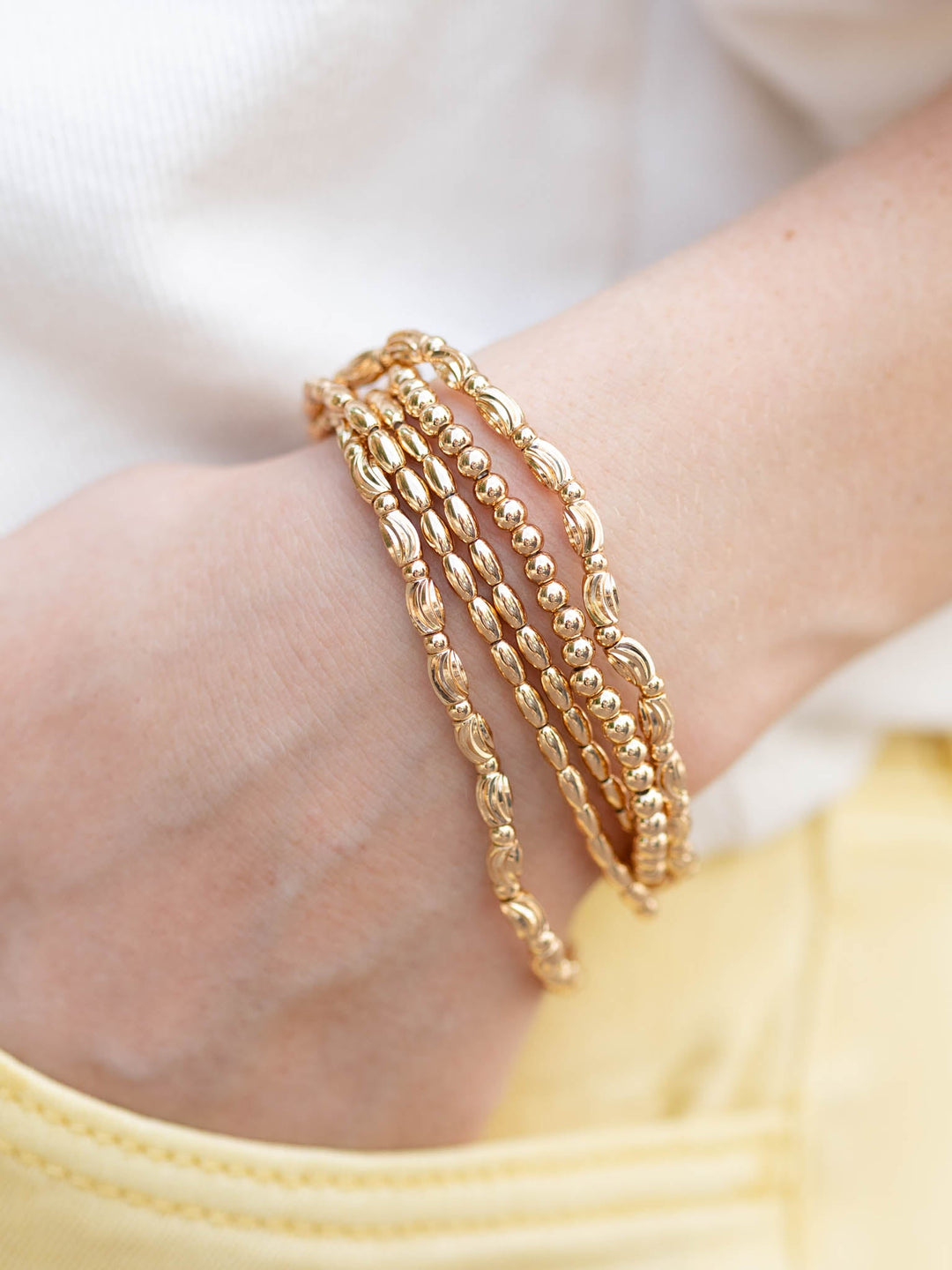 Gold textured beaded oval bracelets