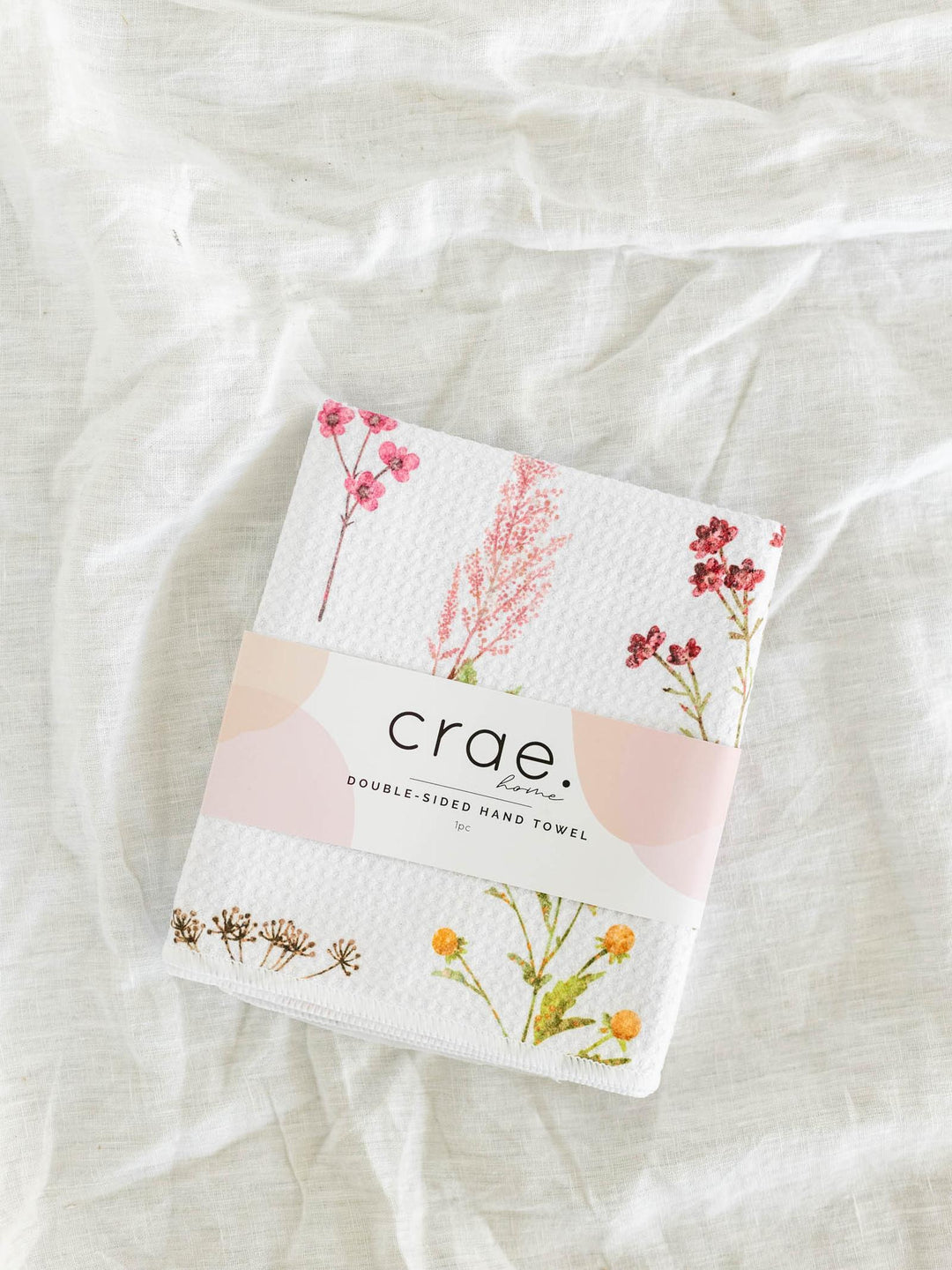 Double-sided hand towel with floral design and &