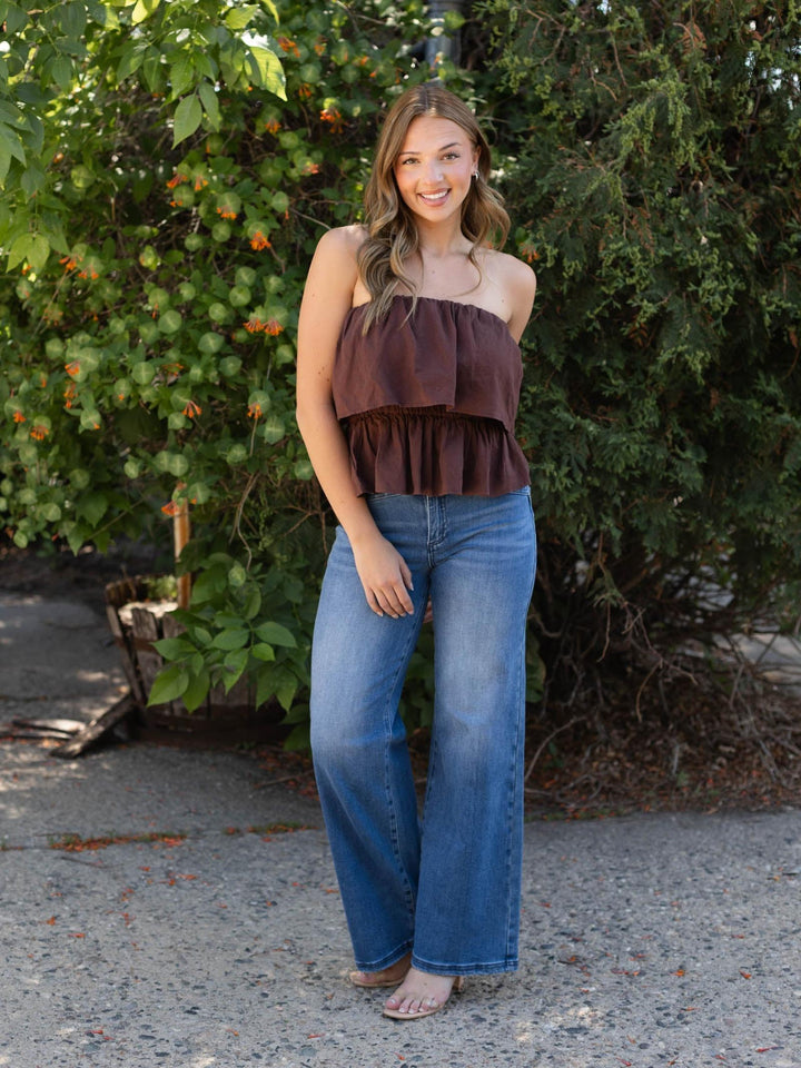 Z Supply Mabel Top: Chocolate Cherry strapless ruffled linen-rayon top with fitted waist, paired with jeans.
