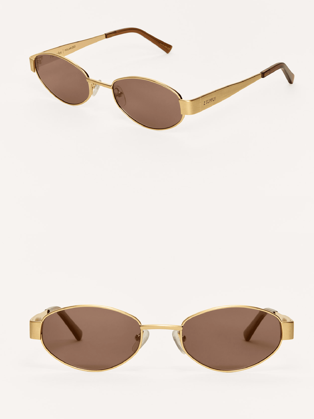 Gold-framed sunglasses with brown lenses on a white background