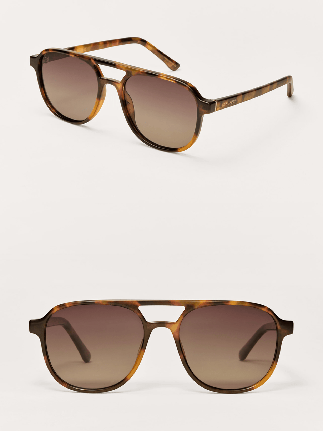 Tortoiseshell sunglasses with brown gradient lenses on a white background