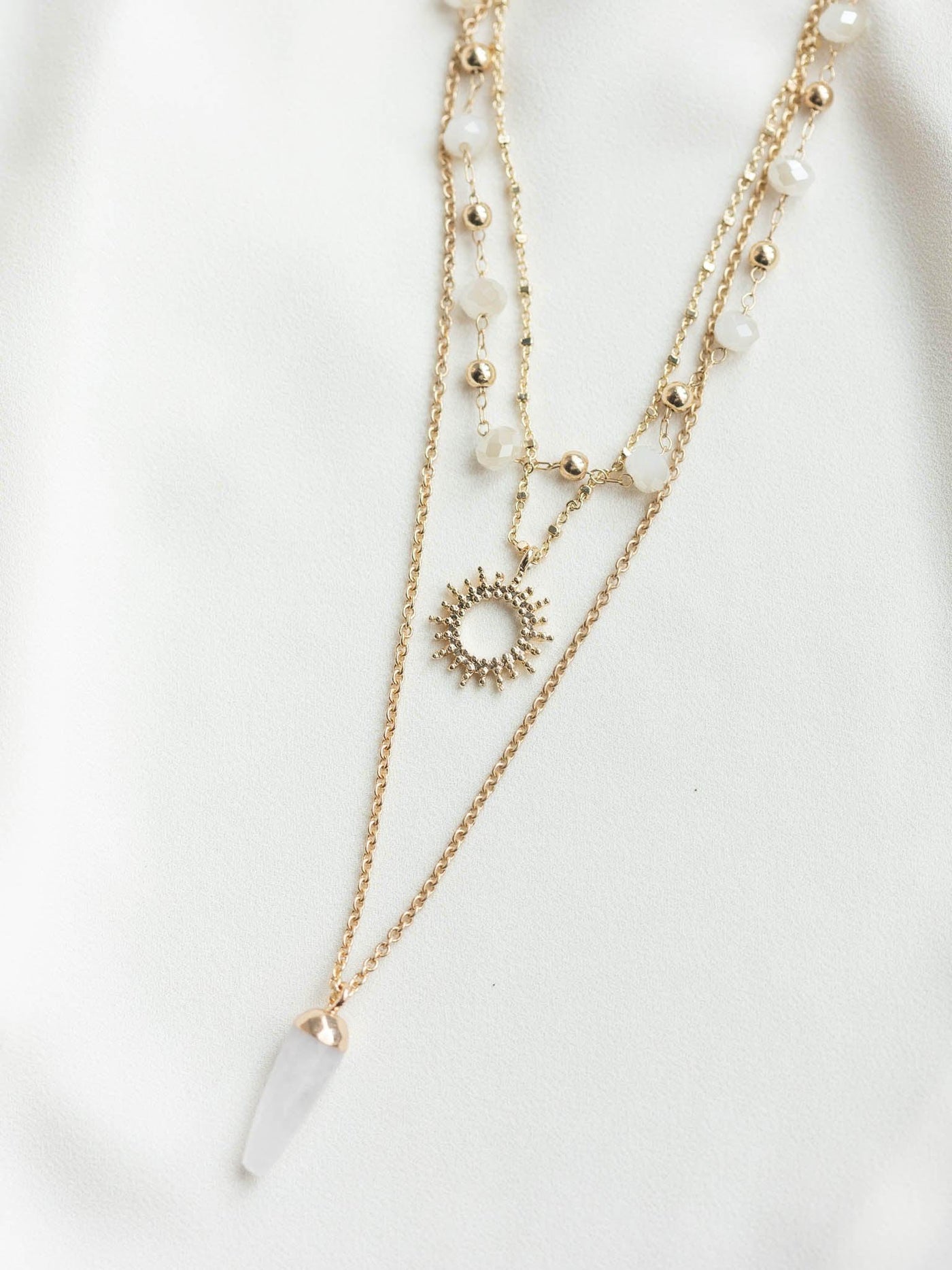 layered bead and metal necklace