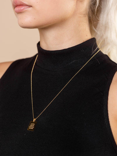 gold text necklace