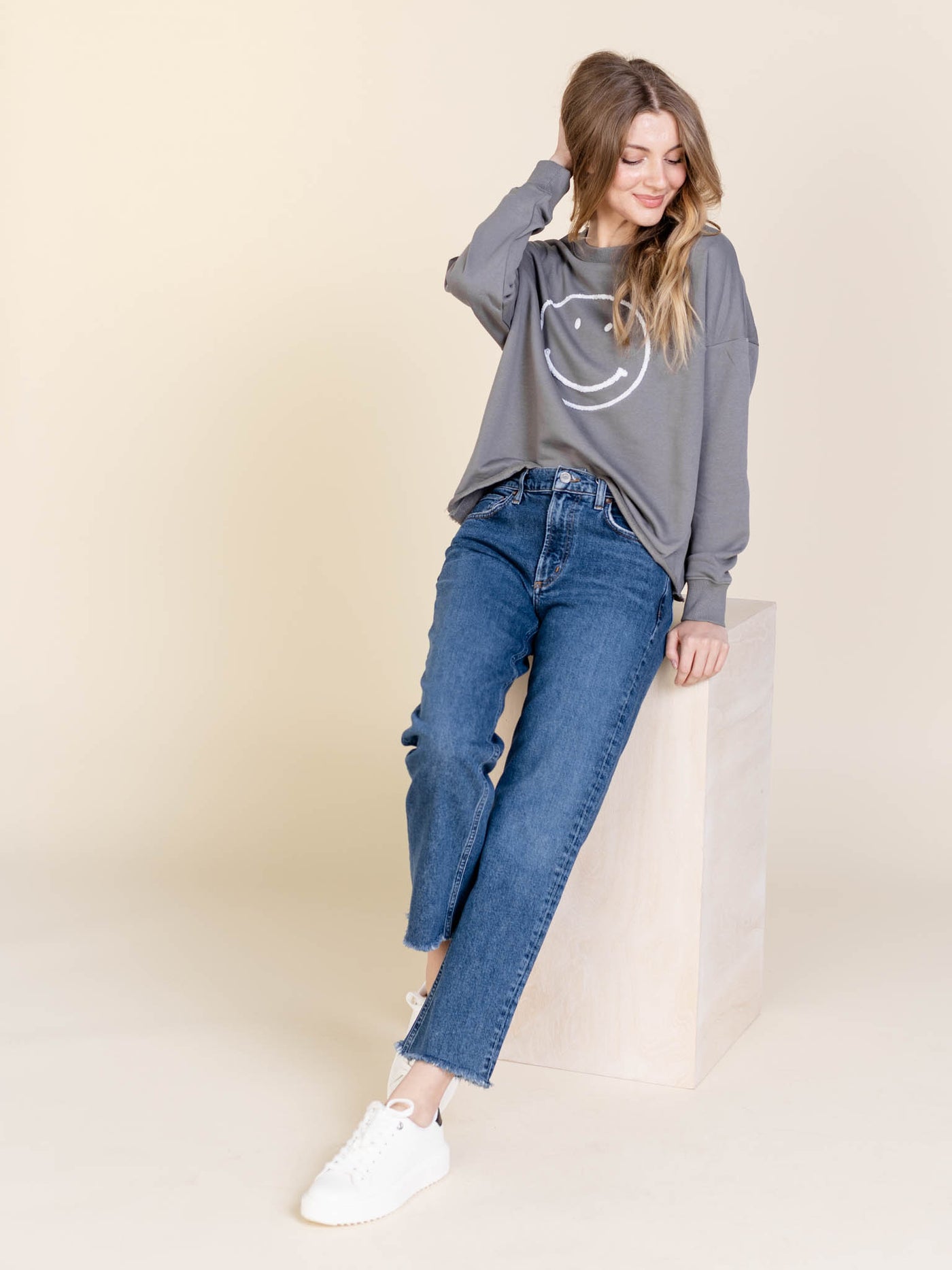 textured smiley face pullover