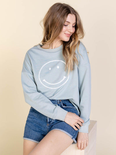 light smiley face graphic top
